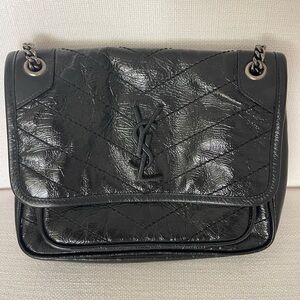 Saint Laurent Black Crinkled Calfskin Matelasse Monogram Baby Niki
$2,000.